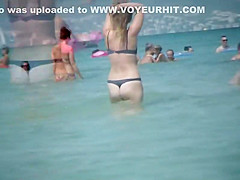 Hot milf enters the water to swim