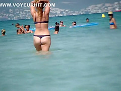 Hot milf enters the water to swim