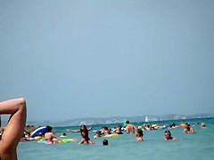 Hot milf enters the water to swim