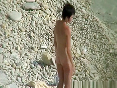 Nudist couple puts sun protection cream on their bodies