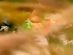 Horny girl masturbating on a beach