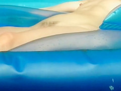 Naked girl creeped in an inflatable pool