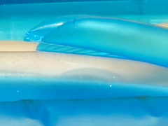 Naked girl creeped in an inflatable pool