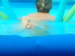 Naked girl creeped in an inflatable pool