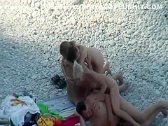 Nudist friends on the beach