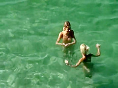 Nudist friends on the beach