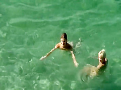 Nudist friends on the beach