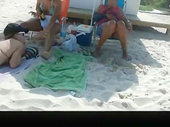 Hot asses in small bikinis in the beach