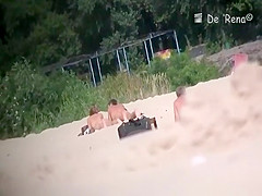 Voyeur at nudist beach films nude men and woman