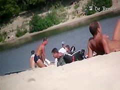 Voyeur at nudist beach films nude men and woman