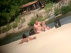 Voyeur at nudist beach films nude men and woman