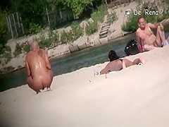 Voyeur at nudist beach films nude men and woman
