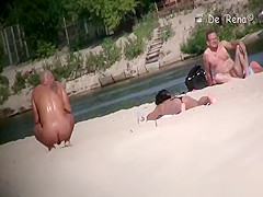Voyeur at nudist beach films nude men and woman