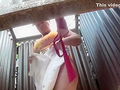 Chubby woman undressing in a cabin