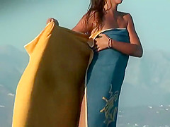 Guy tries to hide his boner with a towel