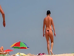 Amazing topless girl at a beach