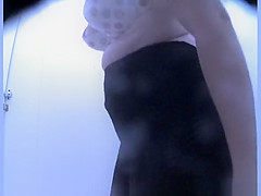 Woman in colorful dark bikini changes it