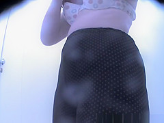 Woman in colorful dark bikini changes it