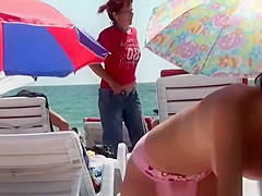 Brunette hot chick in pink bikini topless