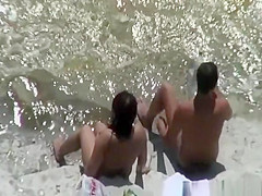 Chubby nudist woman sunbathing and swimming