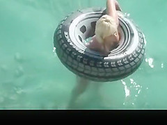 Hot ass blonde playing in the water