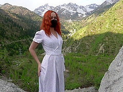 Masked Beauty Loves To Show Herself On A Beautiful Background Of Mountains