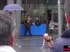 Public slut humiliated on the street by her strict domina