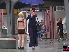 Public slut humiliated on the street by her strict domina