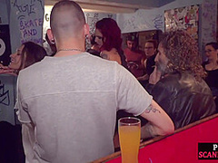 Gagged public slut sucks and cockrides in corwded bar