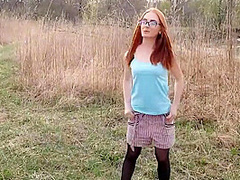 Red-haired Beauty In Nature Stood In A Pose With Cancer For Russian An