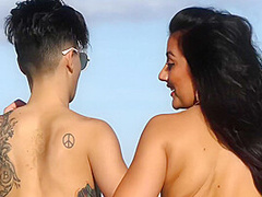 Two Young Hotties Down At The Beach In Bikinis In The Sun Having Fun