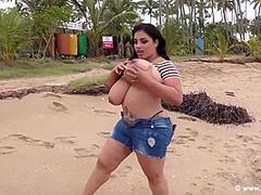 Busty Brunette, Isabella Is Posing Topless On The Beach And