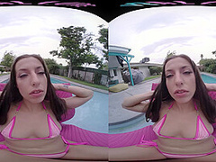 Fit brunette removes her bikini and masturbates in virtual reality
