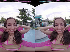Fit brunette removes her bikini and masturbates in virtual reality
