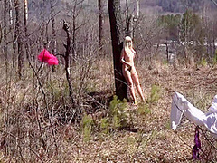 Fusion With Nature In The Outdoors. Blonde With A Big Ass Strips In The Forest And With A Bare Natural Hairy Pussy Playing With A Spruce Twig. 11 Min