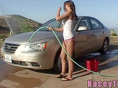 Wet teen babe posing outdoors