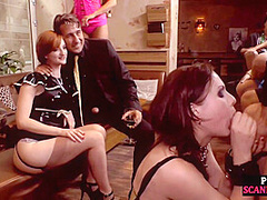 BDSM sub publicly blowing dom in erotic group session
