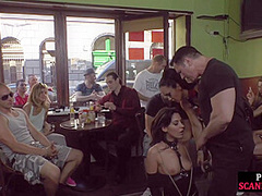 Publicly humiliated sub sucking cock with voyeurs watching