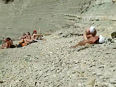 Horny people on the beach having fun