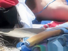 Hot brunette with nice body sunbathing