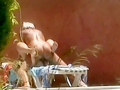 Horny couple fuck is spied by the pool