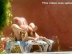 Horny couple fuck is spied by the pool