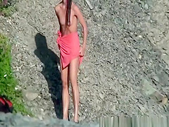 Topless chick shower in nature