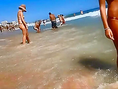 Firm young ass voyeured on a beach