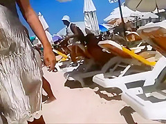 Firm young ass voyeured on a beach