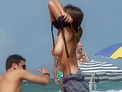 Bent over woman on a beach