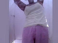 Woman with tan lines caught in beach cabin