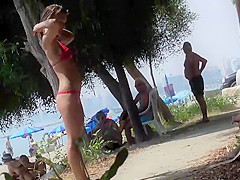 Beautiful beach girl is fully inspected