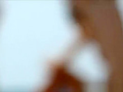 Topless small tanned boobs in beach