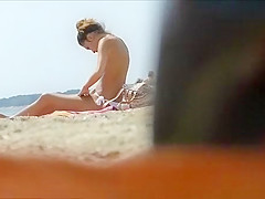 Topless small tanned boobs in beach